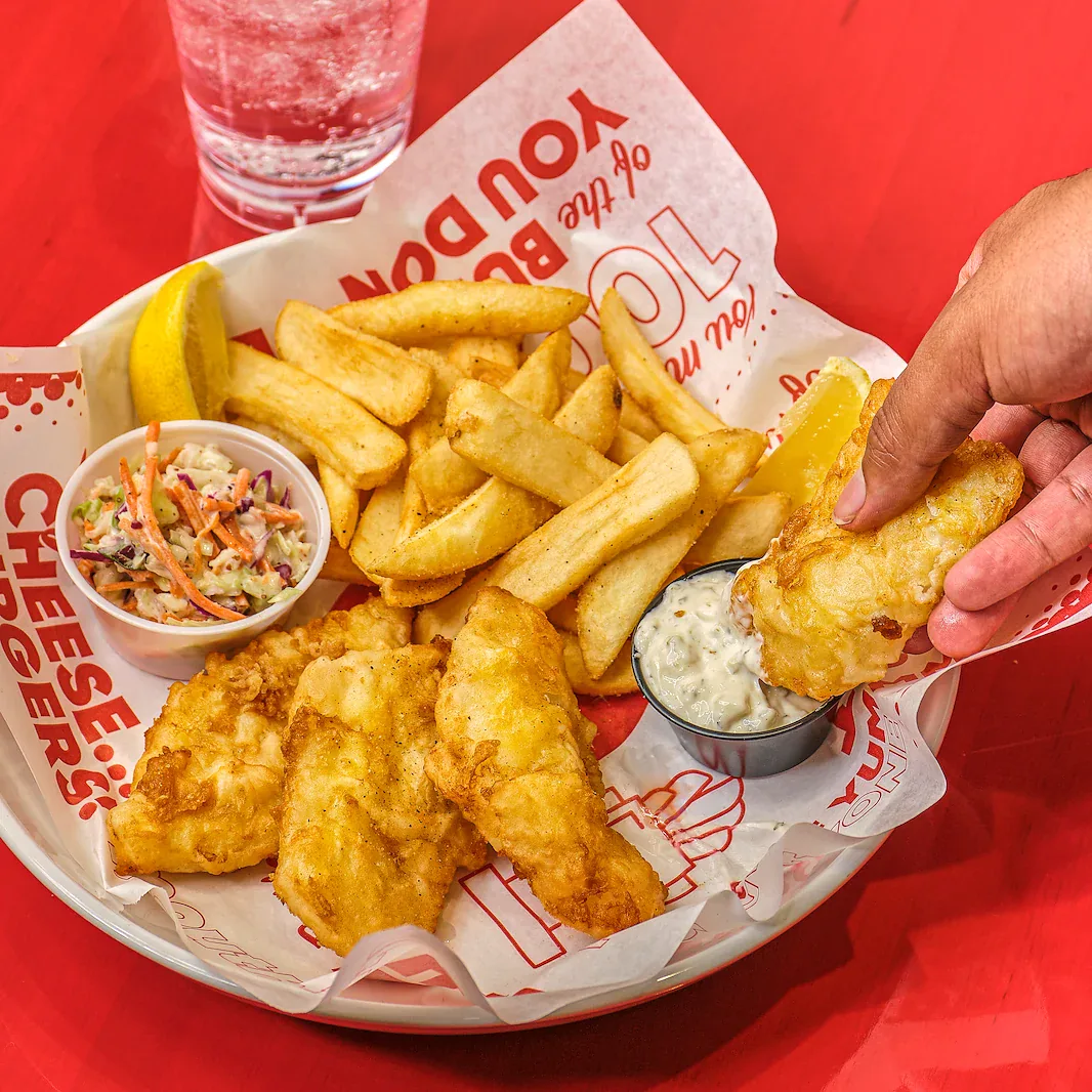 Red Robin fish and chips basket on a red tabletop