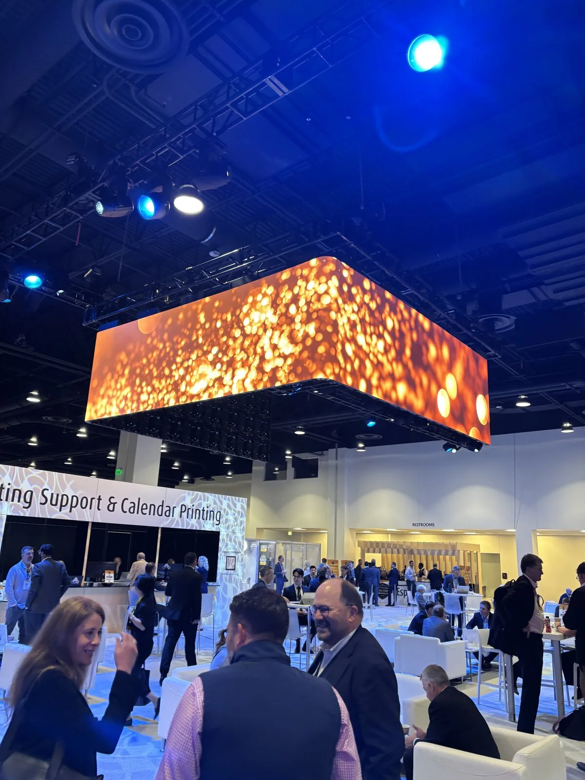 Overhead video banner glowing above the Mining Forum Americas main hall