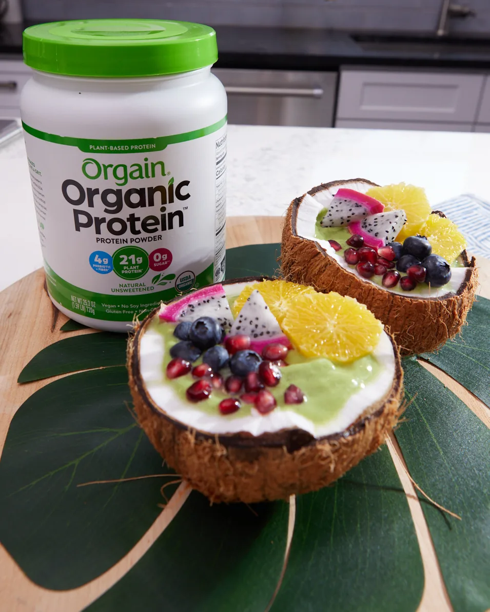 Orgain Natural Unsweetened protein tub with tropical coconut smoothie bowls